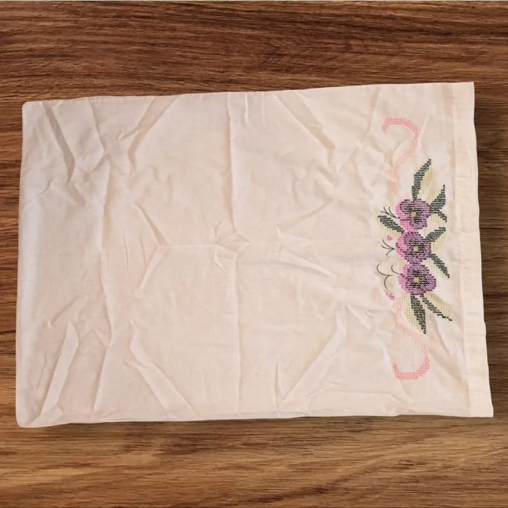 Vintage white pillowcase with embroidered purple‎ flowers